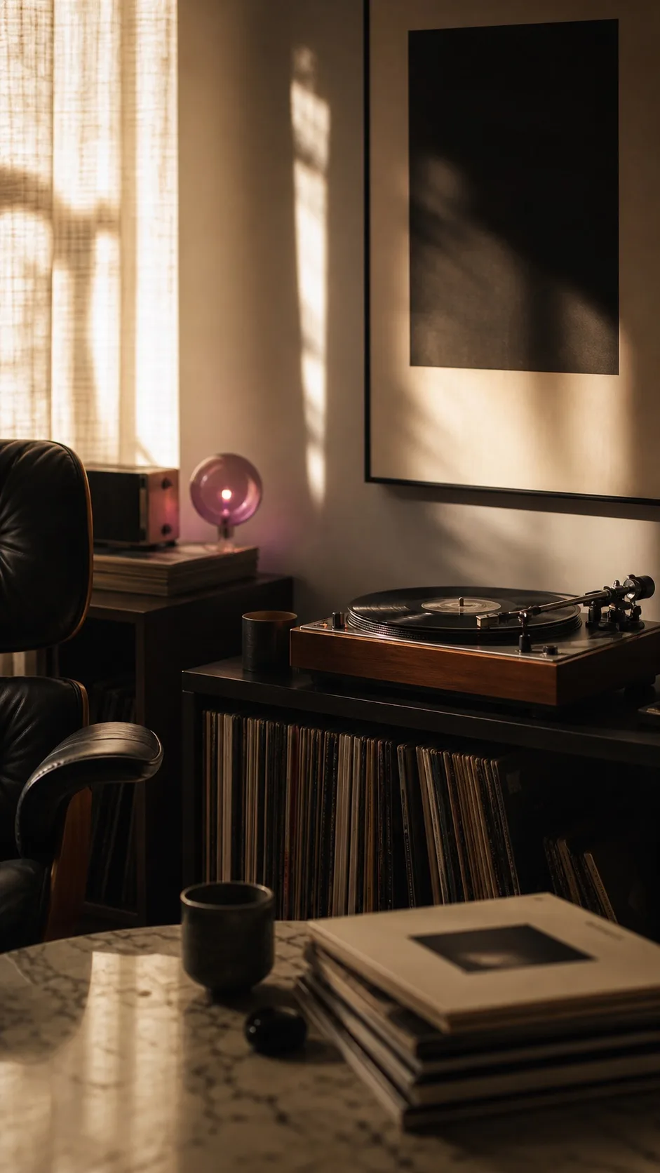 A quiet Lovezone listening room with records, warm light and a turntable