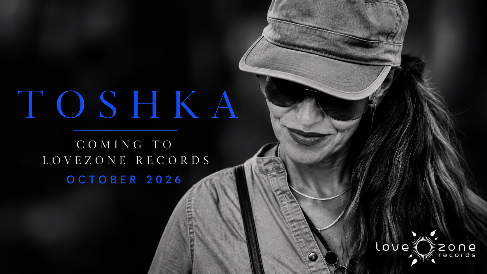 Black-and-white portrait of ToShKa wearing a cap, with blue lettering announcing Lovezone Records in October 2026.